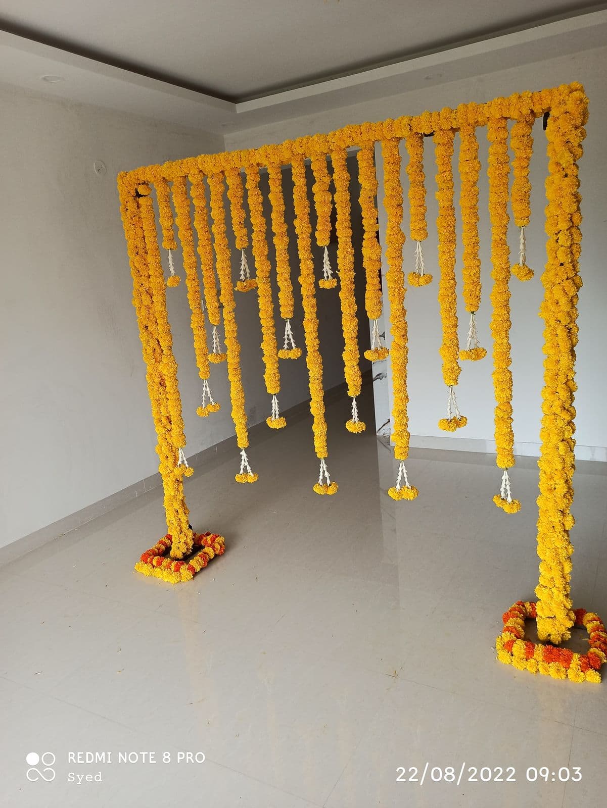 Marigold string gate for a haldi entrance