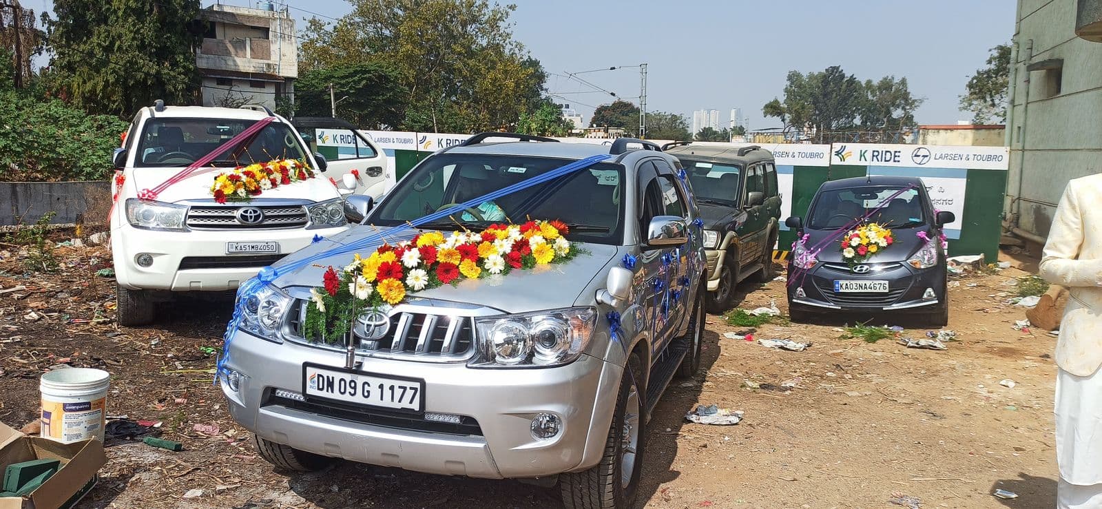 Row of wedding cars decorated with flowers for a baraat