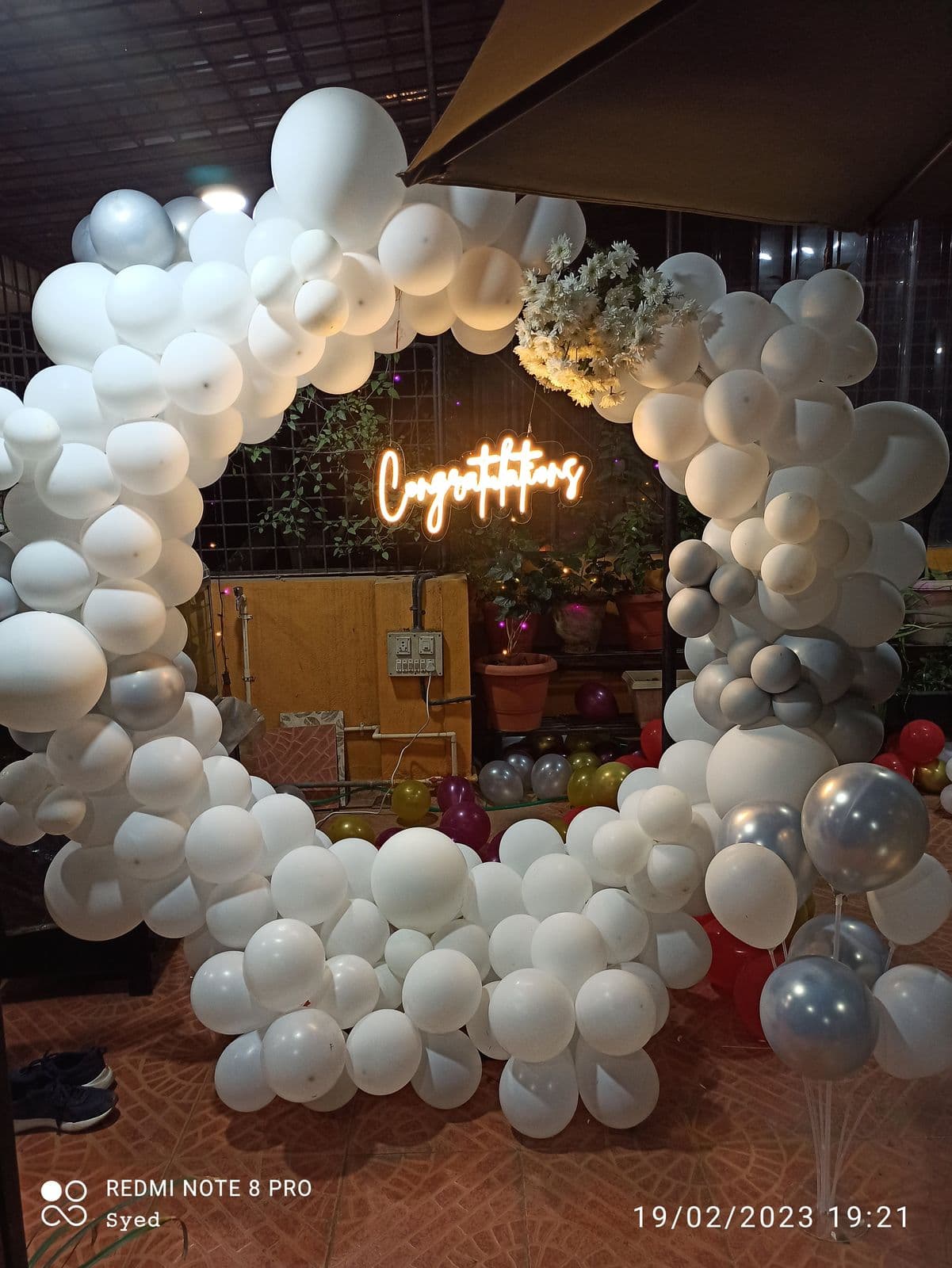 White and silver balloon ring with Congratulations neon