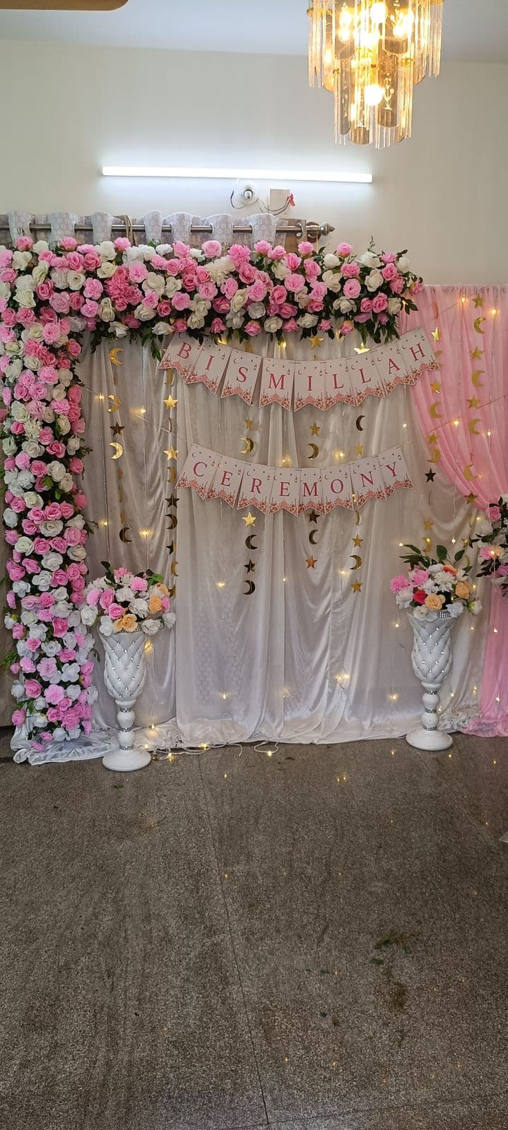 Pink rose floral corner backdrop with ceremony banner